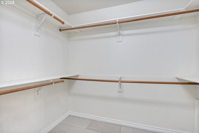 15530 SW Brighton Ct, Beaverton, OR 97007 - walk in closet featuring light tile patterned floors