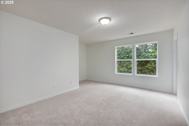 15530 SW Brighton Ct, Beaverton, OR 97007 - unfurnished room featuring light carpet, a textured ceiling, and baseboards