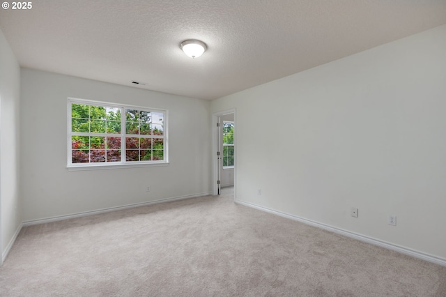 15530 SW Brighton Ct, Beaverton, OR 97007 - carpeted spare room featuring baseboards and a textured ceiling
