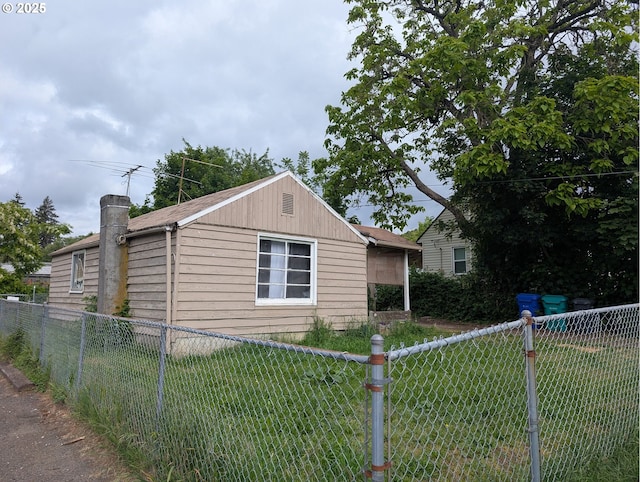 view of side of home featuring a chimney