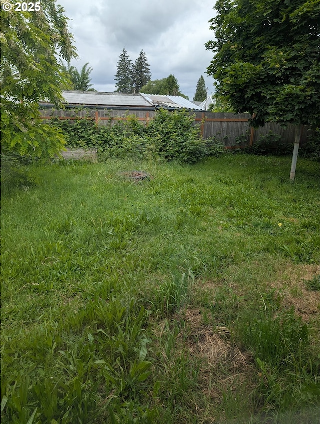 view of yard featuring fence