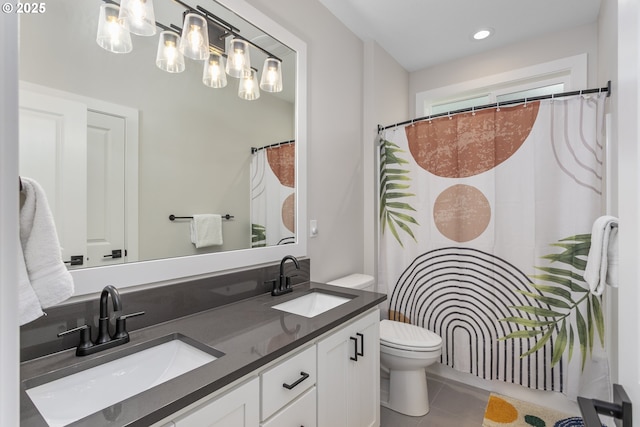 6621 NW Lolo Ter, Portland, OR 97229 - bathroom featuring double vanity, tile patterned floors, curtained shower, and recessed lighting