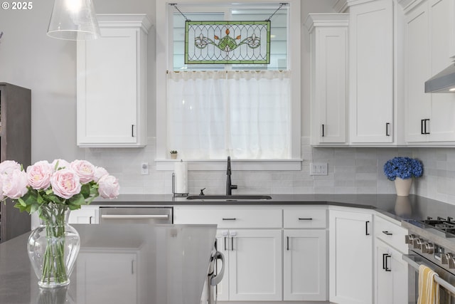 6621 NW Lolo Ter, Portland, OR 97229 - kitchen featuring white cabinets, dark countertops, and decorative backsplash