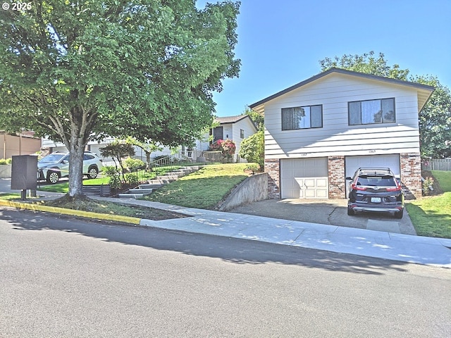 1367 NW Riverview Ave, Gresham, OR 97030 - view of front facade featuring an attached garage, brick siding, and driveway