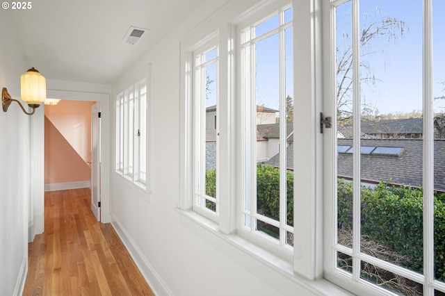 460 Bush St SE, Salem, OR 97302 - hallway with healthy amount of natural light, light wood-style flooring, and baseboards