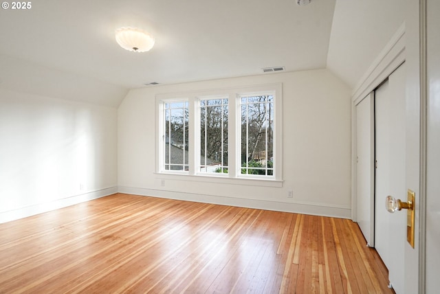 460 Bush St SE, Salem, OR 97302 - additional living space featuring vaulted ceiling, light wood-style floors, and baseboards