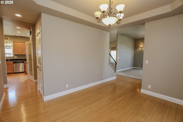 1680 NW Avery St, Roseburg, OR 97471 - spare room with light wood finished floors, recessed lighting, a chandelier, baseboards, and stairs