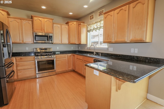 1680 NW Avery St, Roseburg, OR 97471 - kitchen with stainless steel appliances, a sink, a peninsula, light brown cabinetry, and recessed lighting