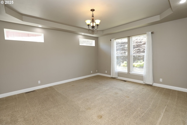 1680 NW Avery St, Roseburg, OR 97471 - spare room with a tray ceiling, a chandelier, carpet floors, baseboards, and recessed lighting