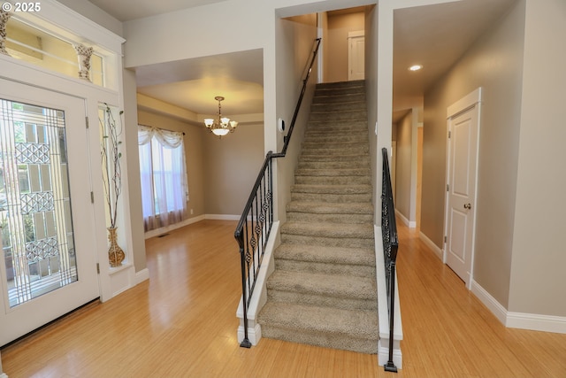 1680 NW Avery St, Roseburg, OR 97471 - staircase with wood finished floors, baseboards, a chandelier, and recessed lighting