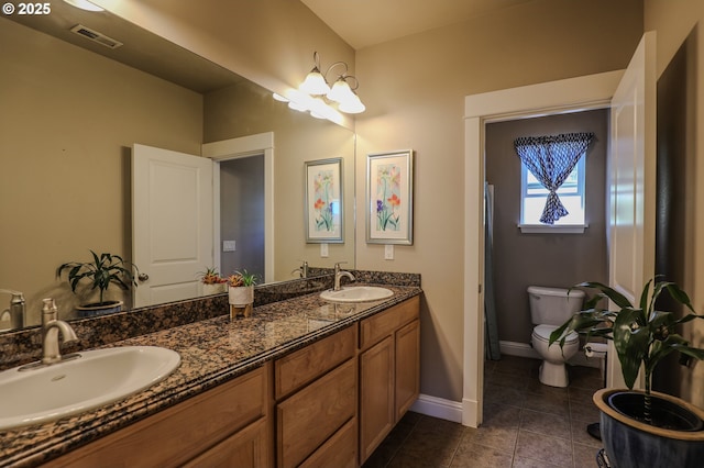 1680 NW Avery St, Roseburg, OR 97471 - full bathroom with toilet, tile patterned floors, double vanity, and baseboards