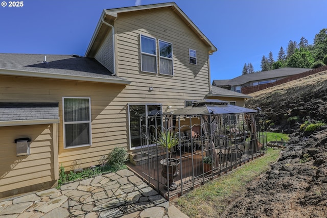 1680 NW Avery St, Roseburg, OR 97471 - back of property with a gazebo, a patio area, and roof with shingles