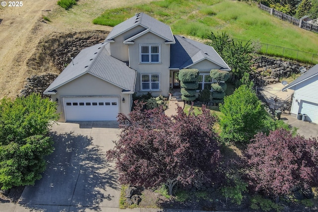 1680 NW Avery St, Roseburg, OR 97471 - view of front of house featuring concrete driveway, stucco siding, fence, and a garage