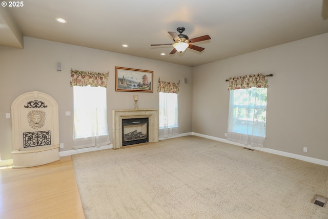 1680 NW Avery St, Roseburg, OR 97471 - unfurnished living room featuring a ceiling fan, recessed lighting, a fireplace, and baseboards