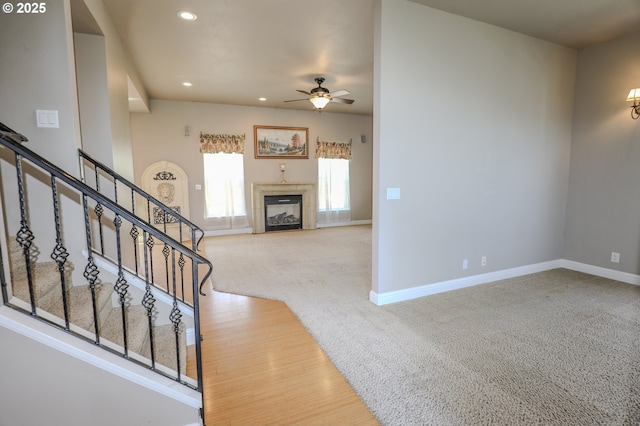1680 NW Avery St, Roseburg, OR 97471 - foyer entrance featuring ceiling fan, a fireplace, carpet flooring, stairs, and recessed lighting