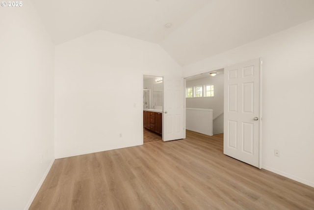 17246 SW Pleasanton Ln, Beaverton, OR 97003 - unfurnished bedroom with light wood-style flooring, lofted ceiling, ensuite bath, and baseboards