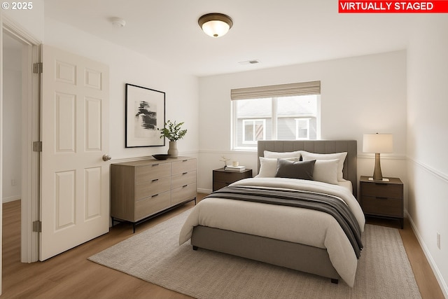 17246 SW Pleasanton Ln, Beaverton, OR 97003 - bedroom with light wood-style flooring and baseboards