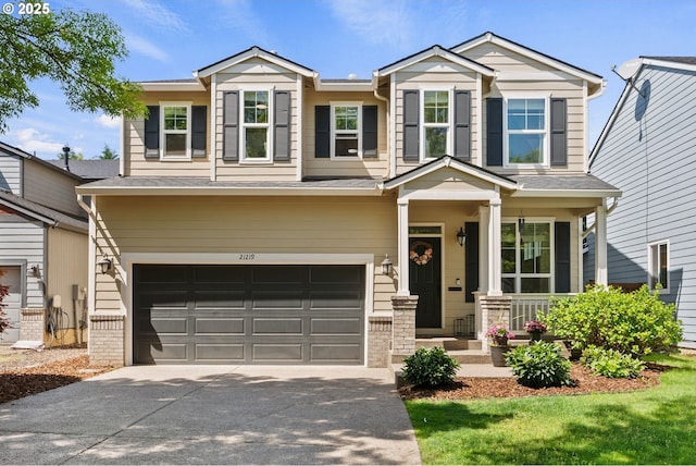 craftsman house with a garage, driveway, and covered porch