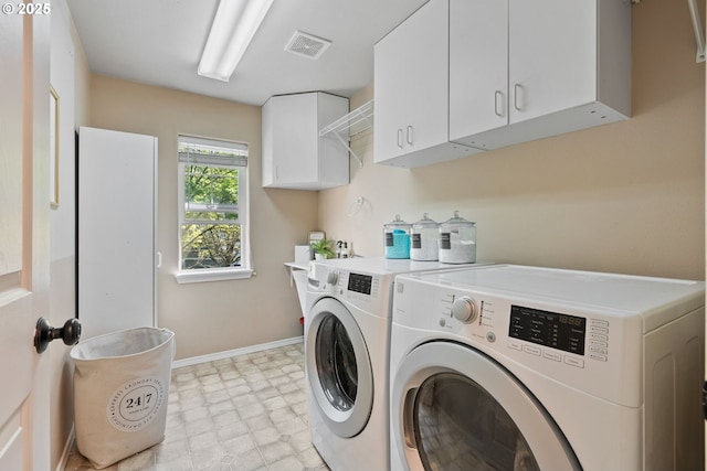 clothes washing area with visible vents, baseboards, light floors, cabinet space, and independent washer and dryer