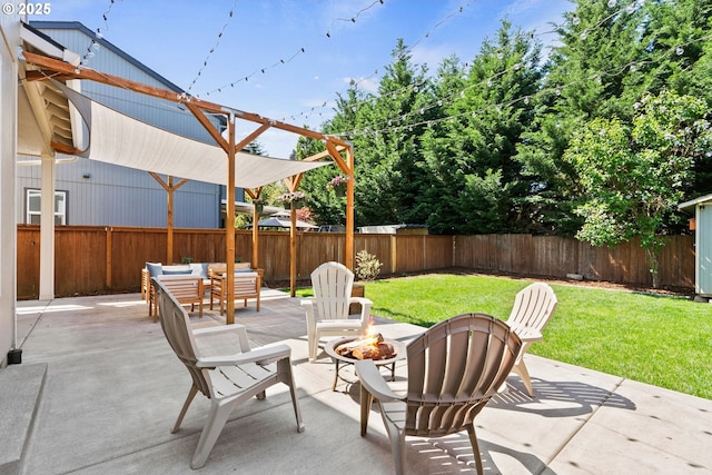 view of patio with a fenced backyard and a fire pit