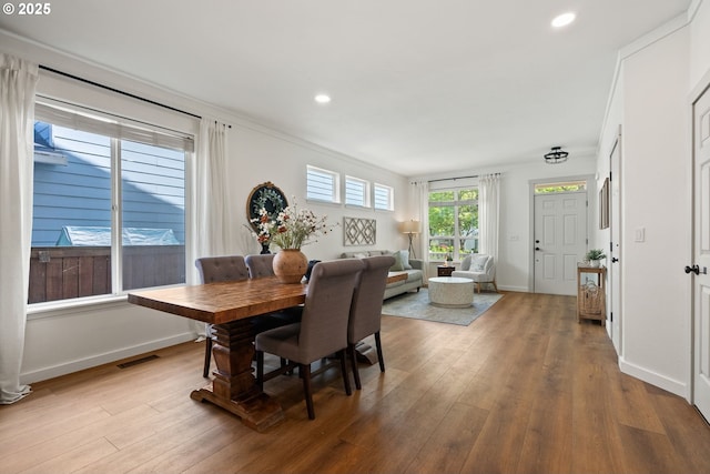 dining room featuring recessed lighting, baseboards, visible vents, and hardwood / wood-style flooring