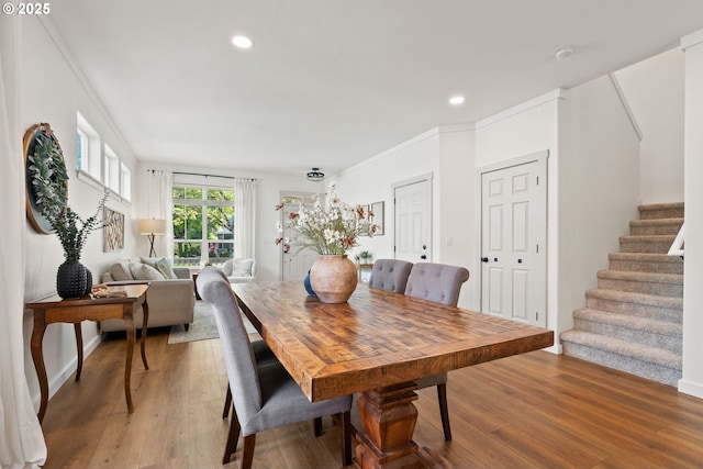 dining area featuring recessed lighting, stairway, and light wood-type flooring