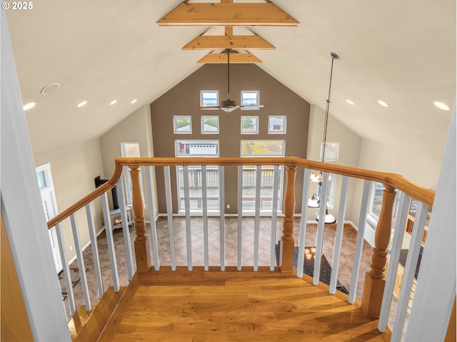 interior space with high vaulted ceiling, a ceiling fan, and wood finished floors