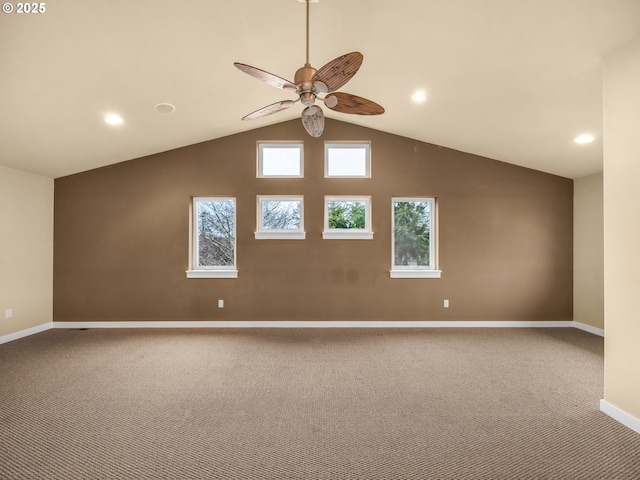 interior space with carpet, recessed lighting, a ceiling fan, vaulted ceiling, and baseboards