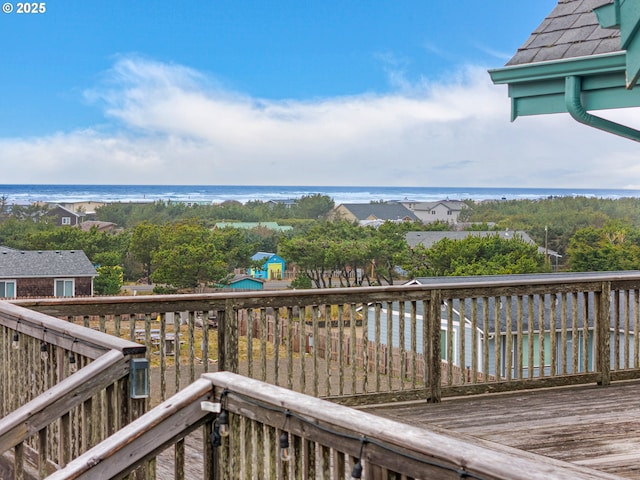 wooden deck featuring a water view