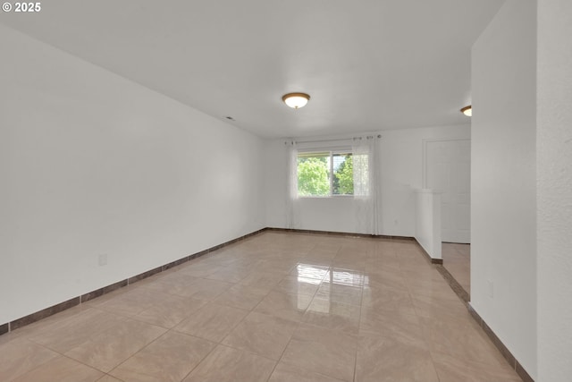 empty room with baseboards