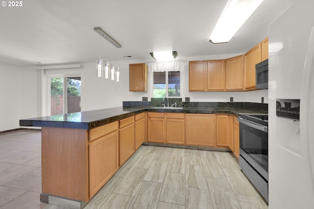 kitchen with tile countertops, pendant lighting, a sink, a peninsula, and stainless steel range with electric stovetop