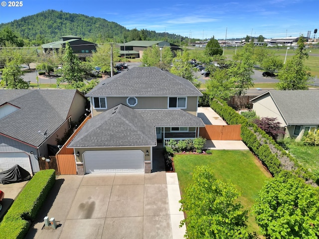 aerial view featuring a mountain view and a residential view