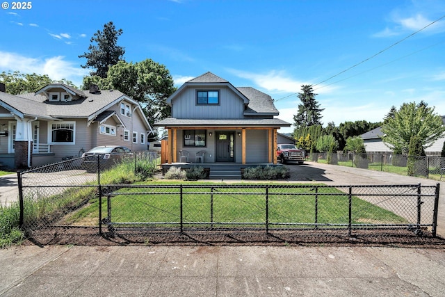 view of front of house featuring covered porch, driveway, and board and batten siding