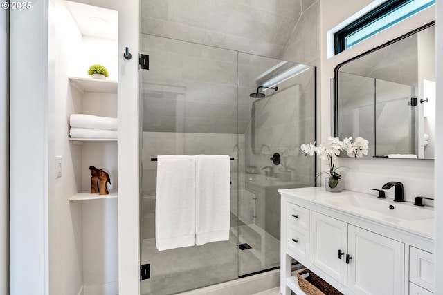 full bath featuring vanity and a stall shower