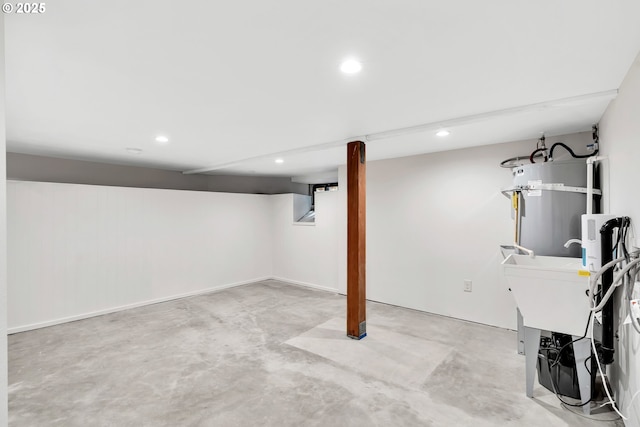 finished basement with recessed lighting and water heater