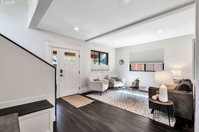 foyer with wood finished floors, recessed lighting, beamed ceiling, and baseboards