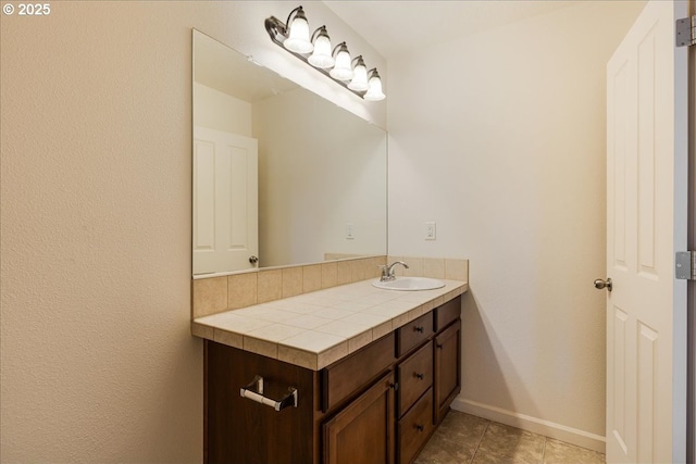 5944 SE Thornapple St, Hillsboro, OR 97123 - bathroom featuring vanity, baseboards, and tile patterned flooring