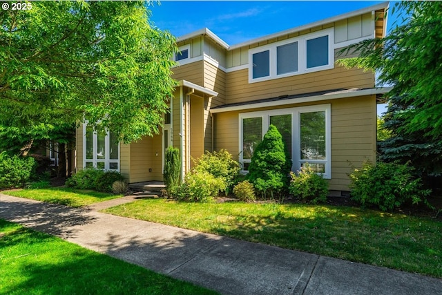 5944 SE Thornapple St, Hillsboro, OR 97123 - view of front of property featuring a front lawn and board and batten siding