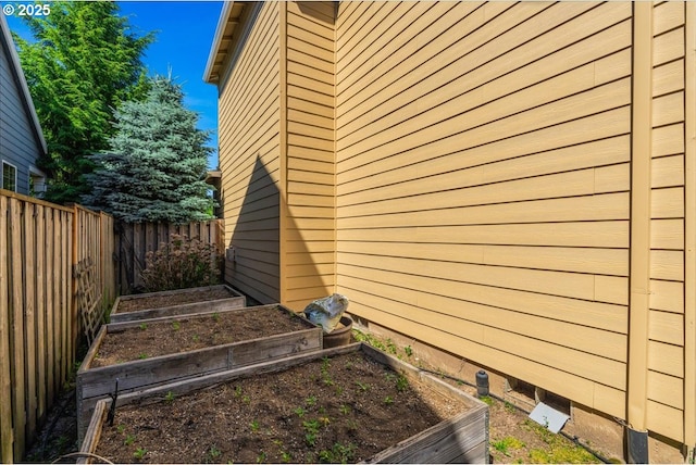 5944 SE Thornapple St, Hillsboro, OR 97123 - view of home's exterior with a vegetable garden