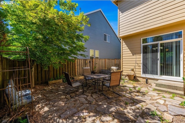 5944 SE Thornapple St, Hillsboro, OR 97123 - fenced backyard featuring a patio and outdoor dining area