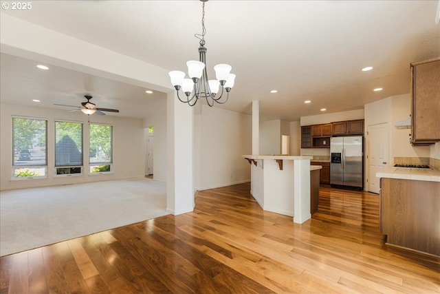 5944 SE Thornapple St, Hillsboro, OR 97123 - kitchen with stainless steel refrigerator with ice dispenser, recessed lighting, open floor plan, light wood finished floors, and gas stovetop