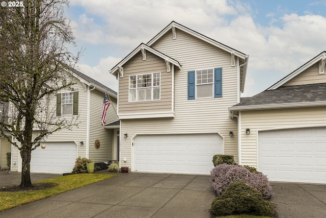 traditional-style home featuring driveway and an attached garage