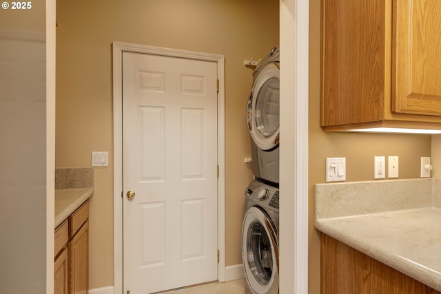 laundry room featuring stacked washing maching and dryer