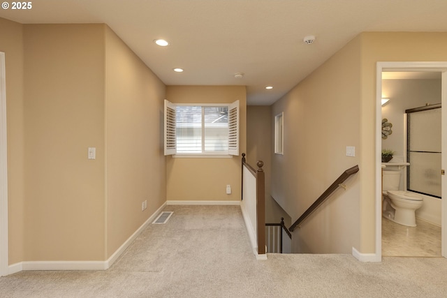 hall featuring carpet floors, recessed lighting, visible vents, an upstairs landing, and baseboards