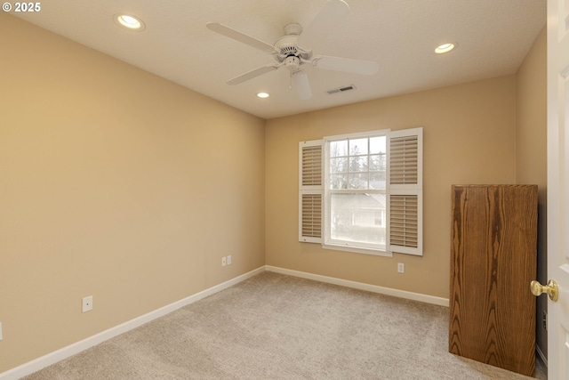 unfurnished room with recessed lighting, visible vents, a ceiling fan, light carpet, and baseboards