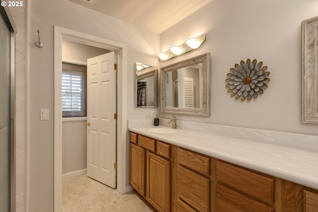 bathroom with baseboards and vanity