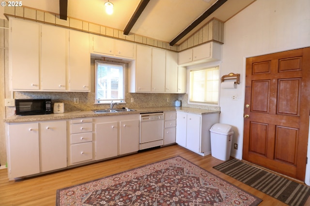 kitchen featuring sink, backsplash, white dishwasher, and light hardwood / wood-style flooring