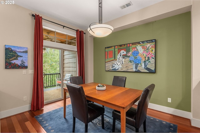 10480 SW Windwood Way, Portland, OR 97225 - dining space featuring baseboards and wood finished floors