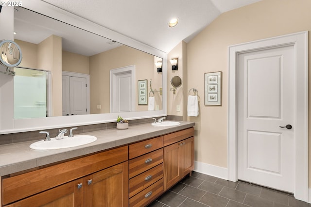 10480 SW Windwood Way, Portland, OR 97225 - bathroom featuring double vanity, tile patterned flooring, and lofted ceiling