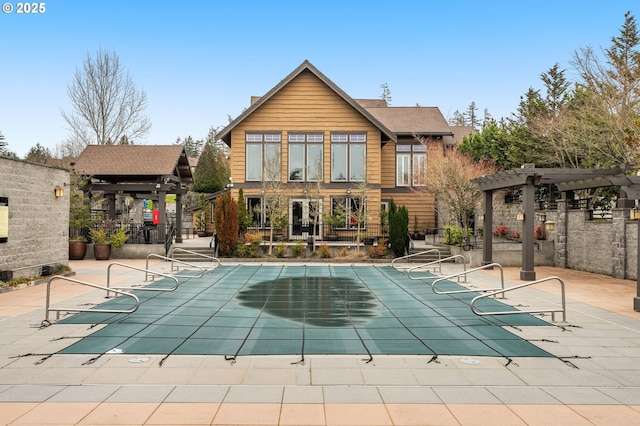 10480 SW Windwood Way, Portland, OR 97225 - back of house with a pergola, a patio, and a community pool